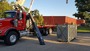 Machine being offloaded by Crane Ohio