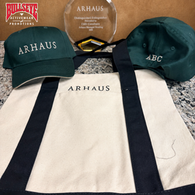 Branded merchandise including a tote bag and embroidered caps