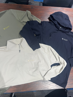Embroidered Air Control Products employee apparel including quarter-zip pullovers and a hoodie